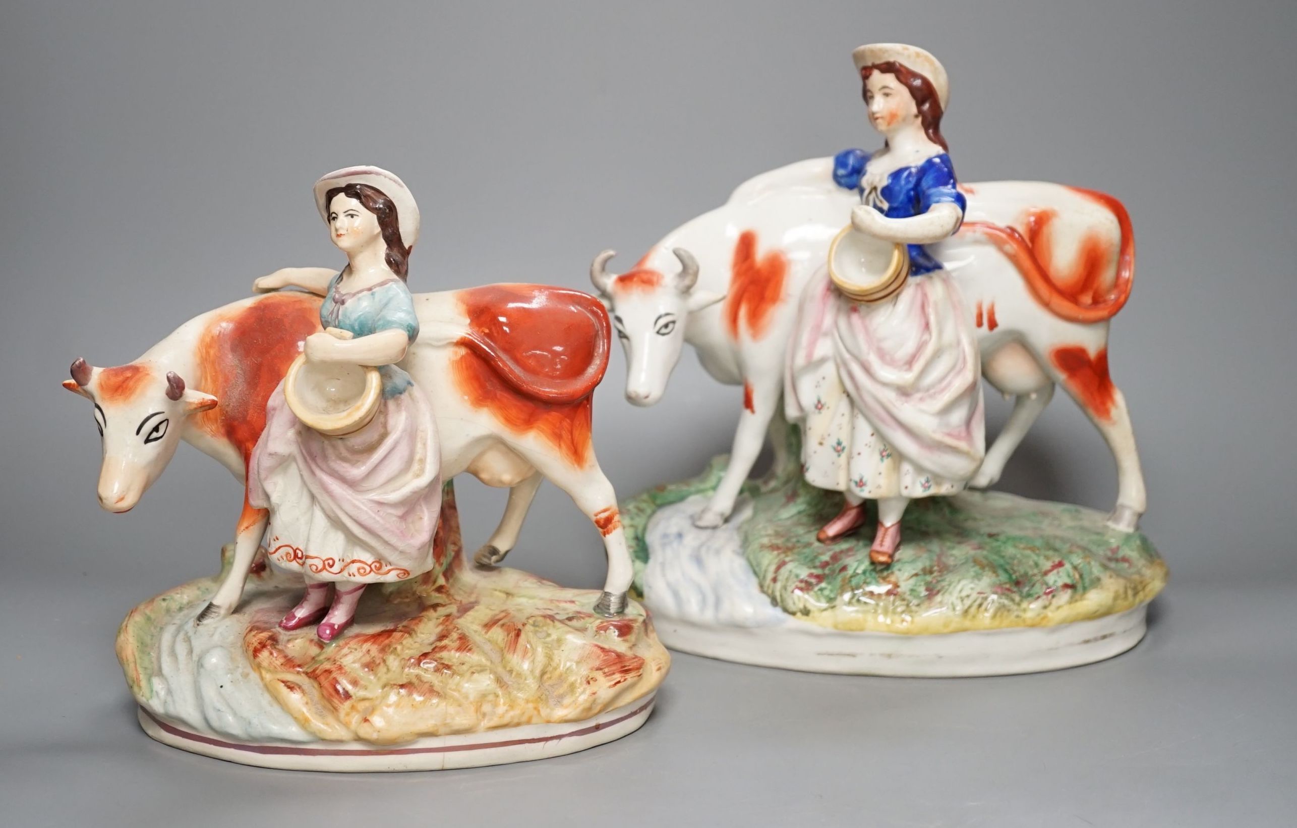 Two 19th century Staffordshire milk maid groups - tallest 24.5cm